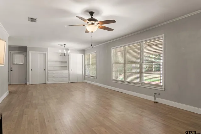 a view of an empty room with a window