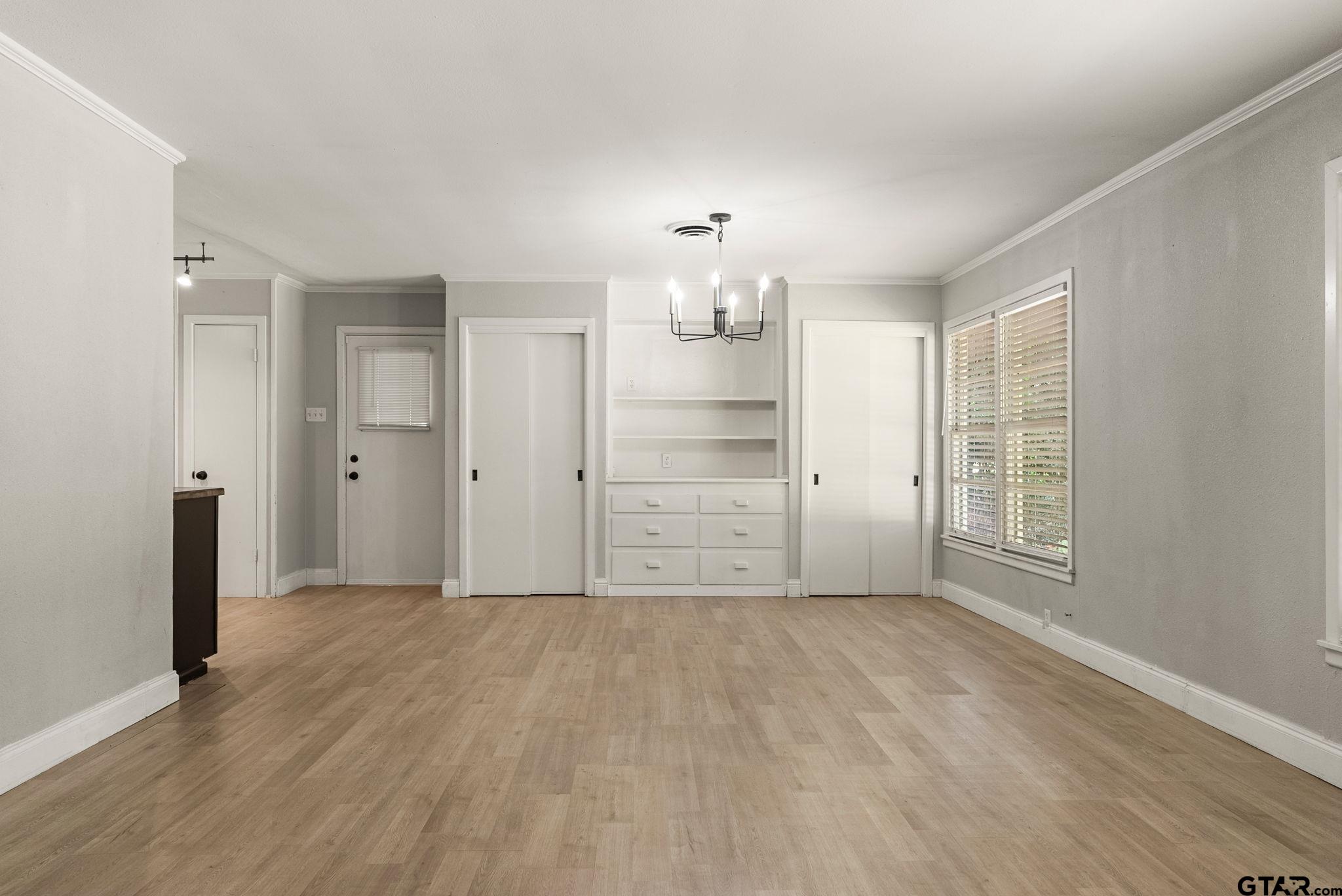 150 Wightman Lane Rusk, TX 75785 - Photo 4 of 38 wooden floor in an empty room with a window