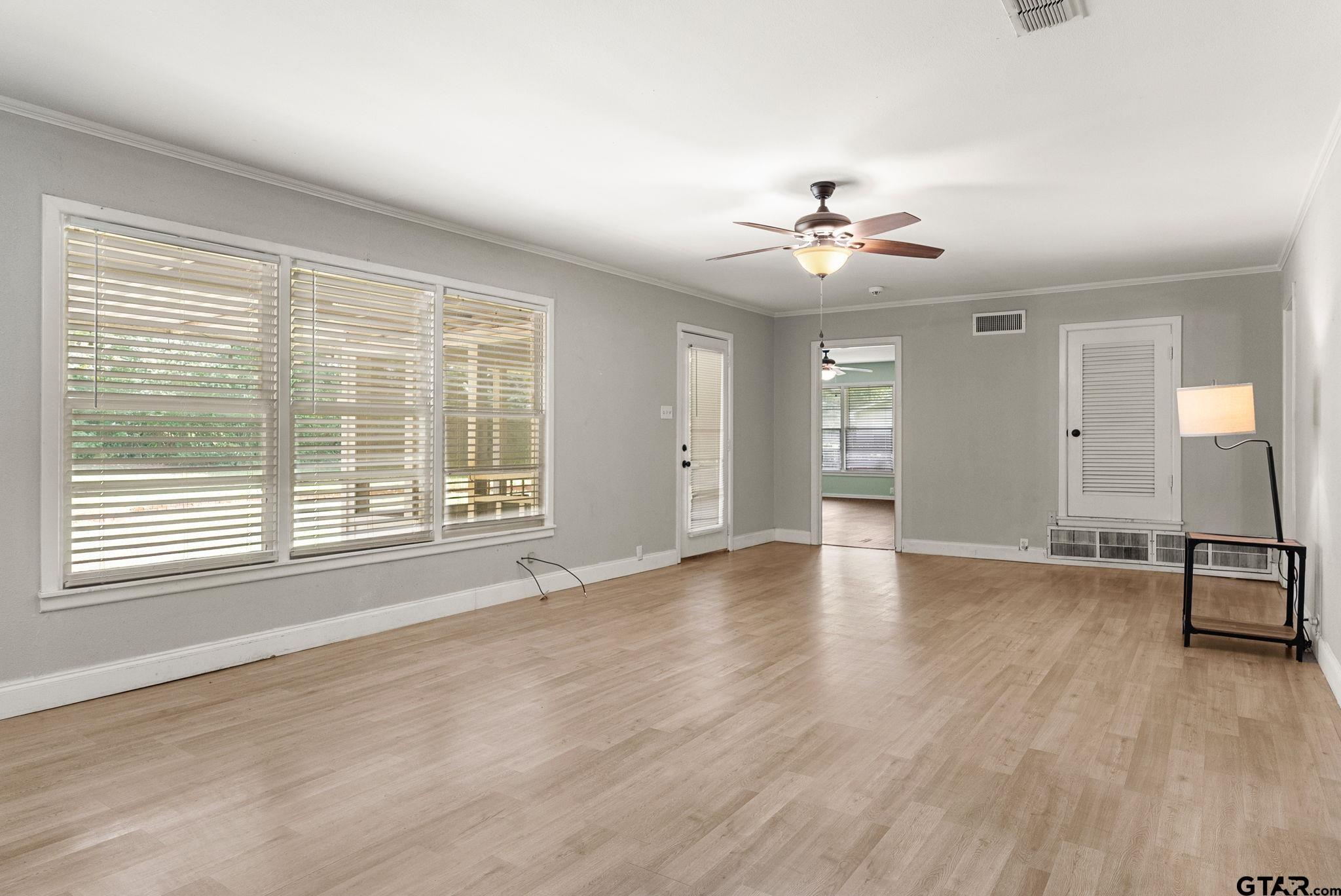 150 Wightman Lane Rusk, TX 75785 - Photo 5 of 38 a view of an empty room with chandelier fan and a window
