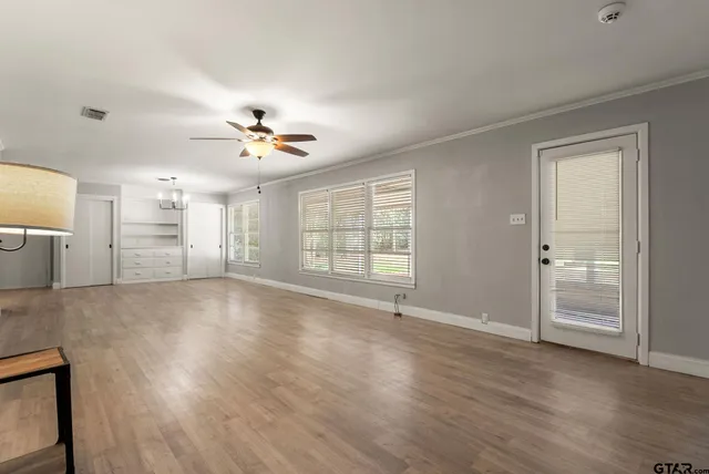 a view of an empty room with a window