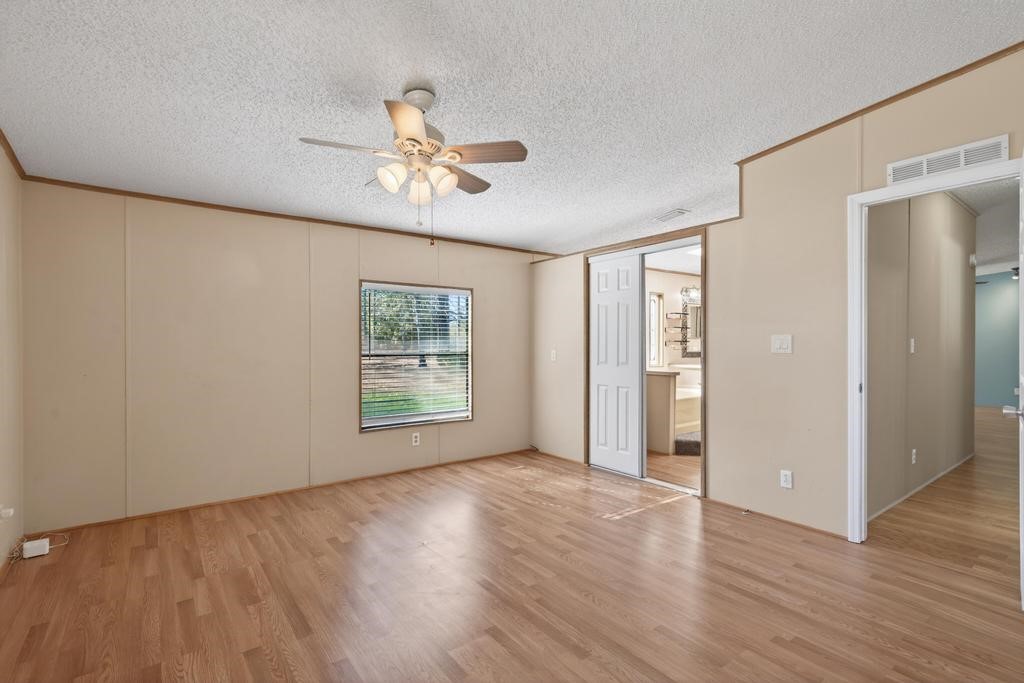 2744 Roy Sikes Road Hilliard, FL 32046 - Photo 50 of 97 a view of an empty room with a window and wooden floor