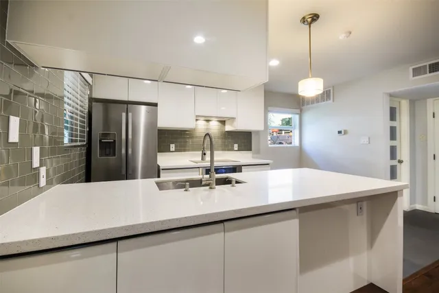 a view of cars parked in front of a building