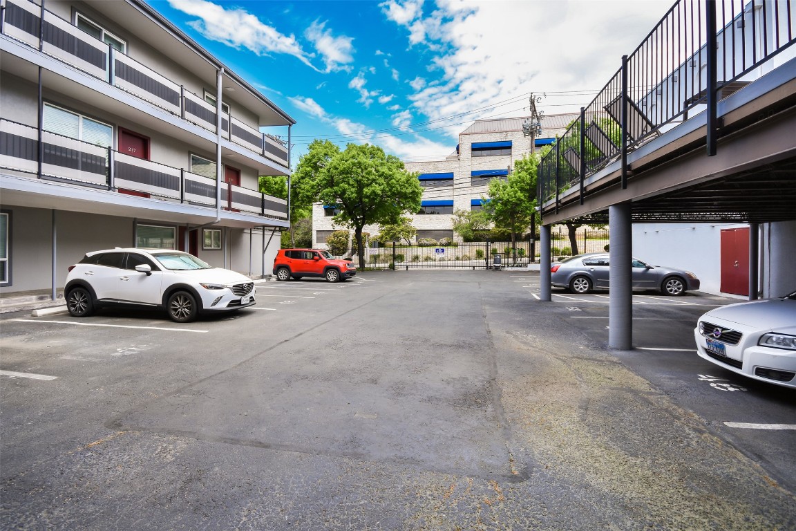 3110 Red River Street, Unit 201 Austin, TX 78705 - Photo 27 of 30 a view of cars parked in front of a building
