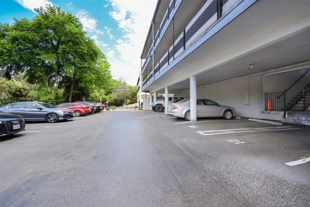 a view of a swimming pool with outdoor seating