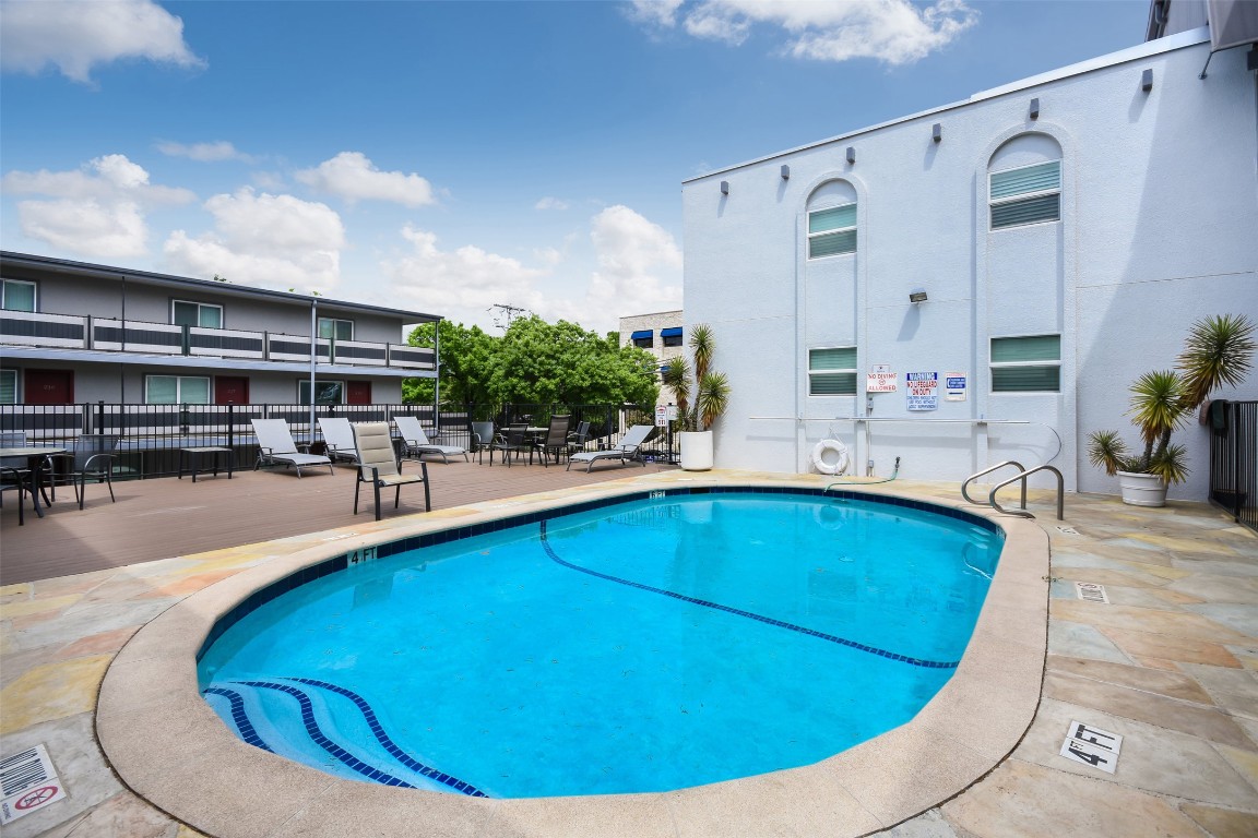 3110 Red River Street, Unit 201 Austin, TX 78705 - Photo 4 of 30 a view of a swimming pool with outdoor seating