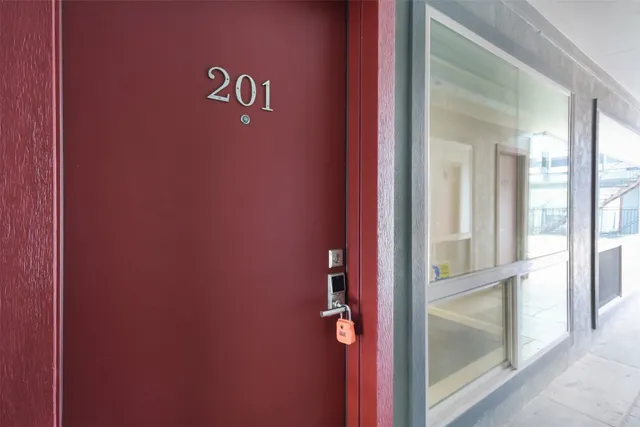 a large kitchen with hardwood floor and a sink