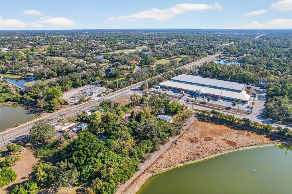 14 Old Venice Road Osprey, FL 34229 - Photo 4 of 20 an aerial view of a house with a lake view