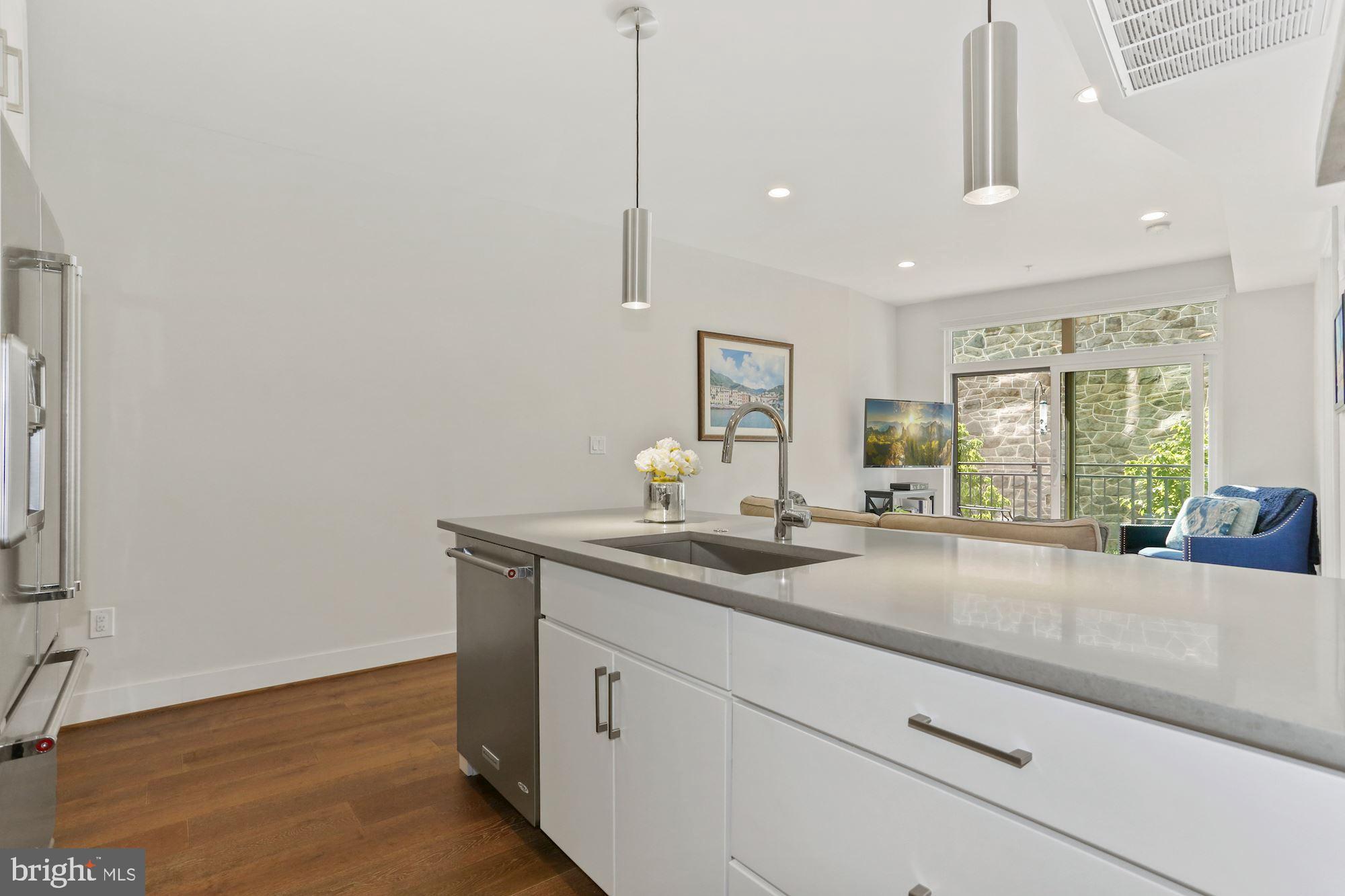 2337 Champlain Street Northwest, Unit 104 Washington, DC 20009 - Photo 15 of 80 Expansive Kitchen Island - Perfect for Meal Prep!