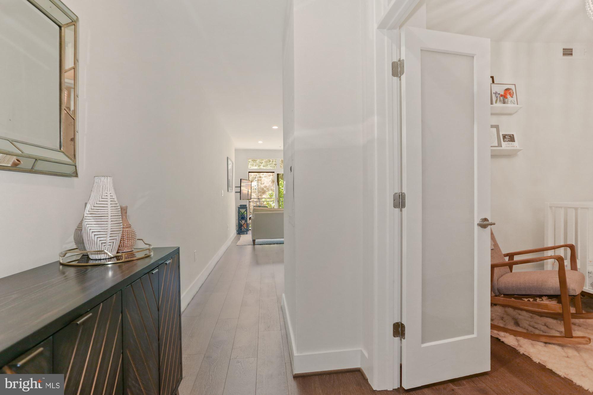 2337 Champlain Street Northwest, Unit 104 Washington, DC 20009 - Photo 7 of 80 Foyer - Wide Plank Hardwood Floors