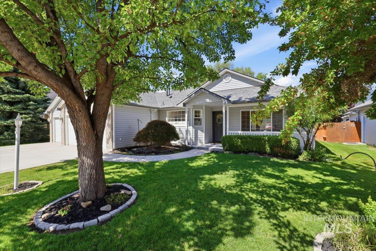 2075 North Springland Place Boise, ID 83713 - Photo 4 of 49 Exterior featuring light gray siding, white trim, and a covered front porch