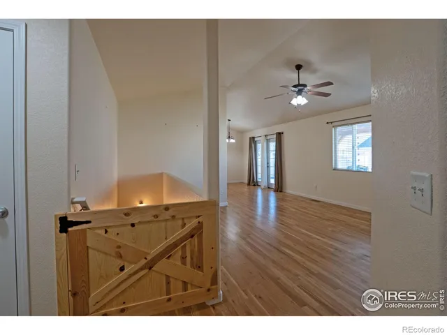 a view of livingroom and kitchen with wooden floor