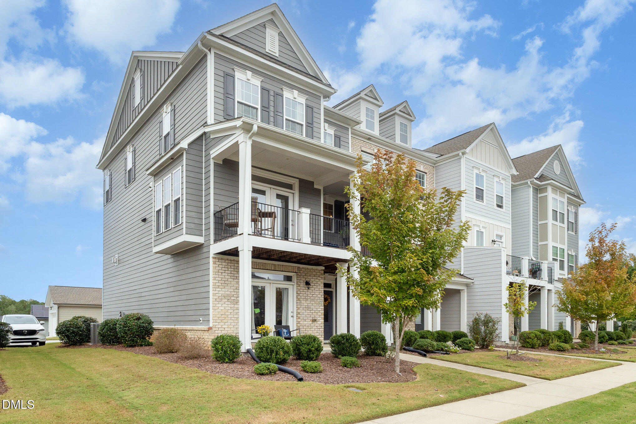 2906 Great Lawn Road Apex, NC 27502 - Photo 1 of 41 a front view of a residential apartment building with a yard