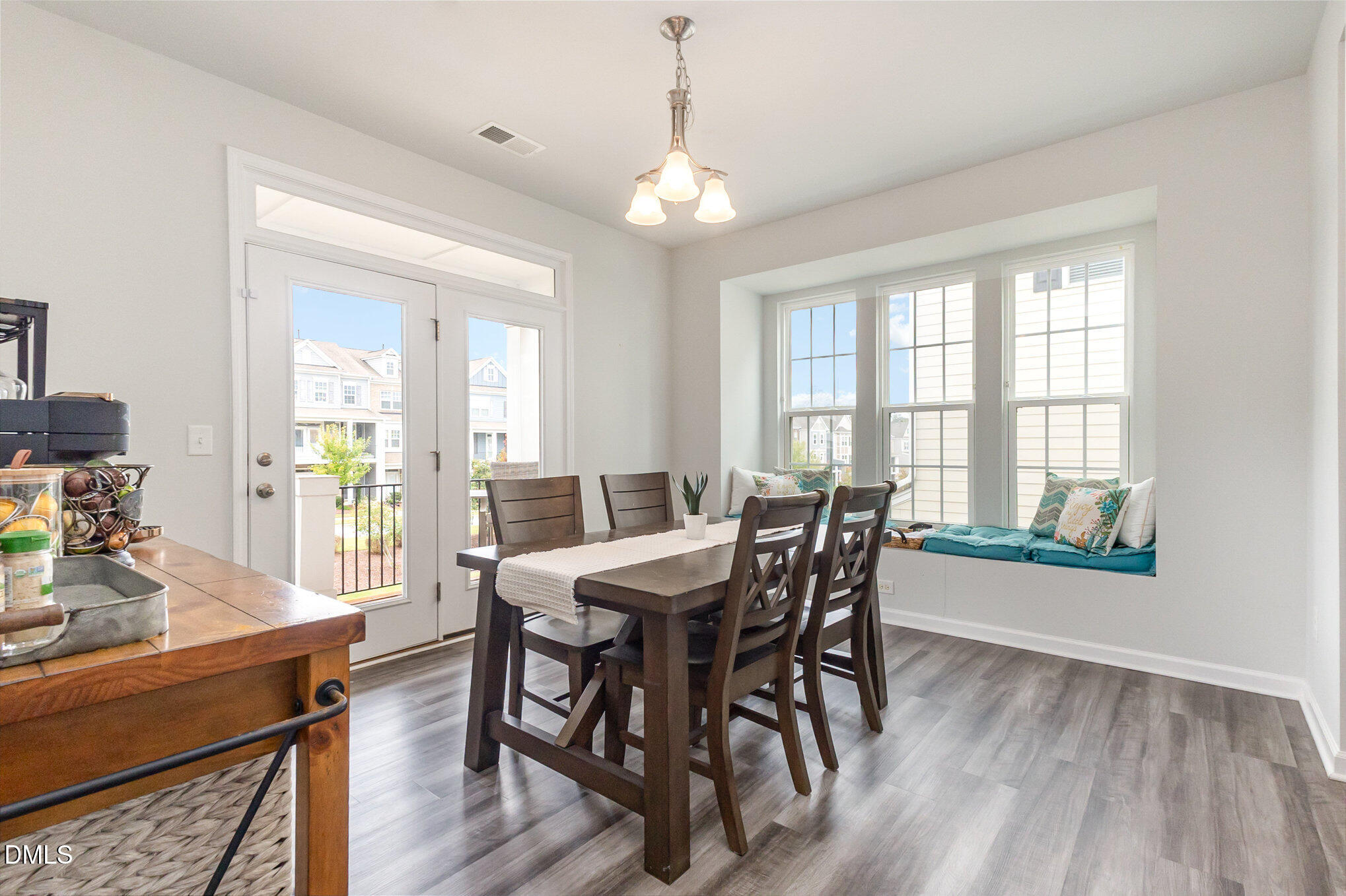2906 Great Lawn Road Apex, NC 27502 - Photo 11 of 41 a view of a dining room with furniture window and wooden floor