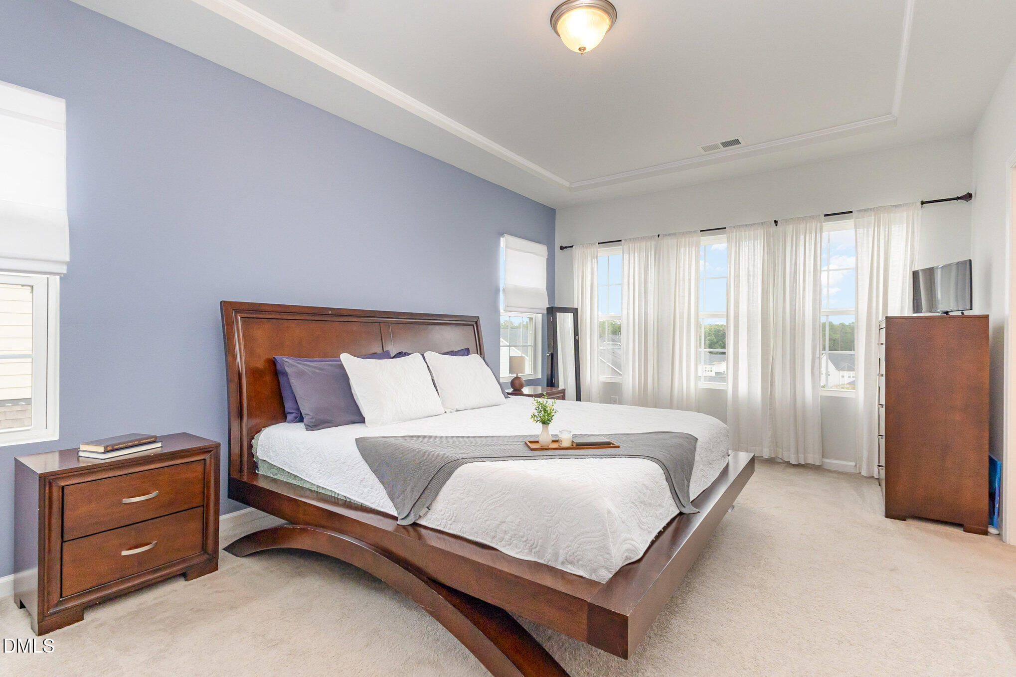 2906 Great Lawn Road Apex, NC 27502 - Photo 22 of 41 a bedroom with a bed and a window