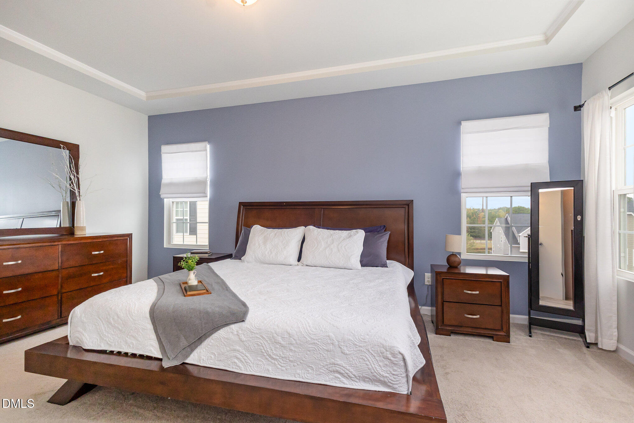 2906 Great Lawn Road Apex, NC 27502 - Photo 23 of 41 a bedroom with a bed and a dresser