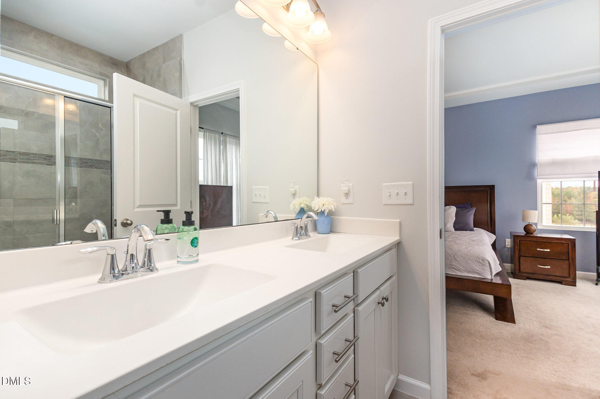 2906 Great Lawn Road Apex, NC 27502 - Photo 26 of 41 a bathroom with a sink double vanity