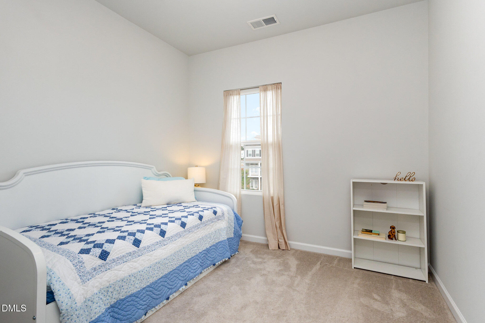 2906 Great Lawn Road Apex, NC 27502 - Photo 29 of 41 a bedroom with a bed and a cabinets