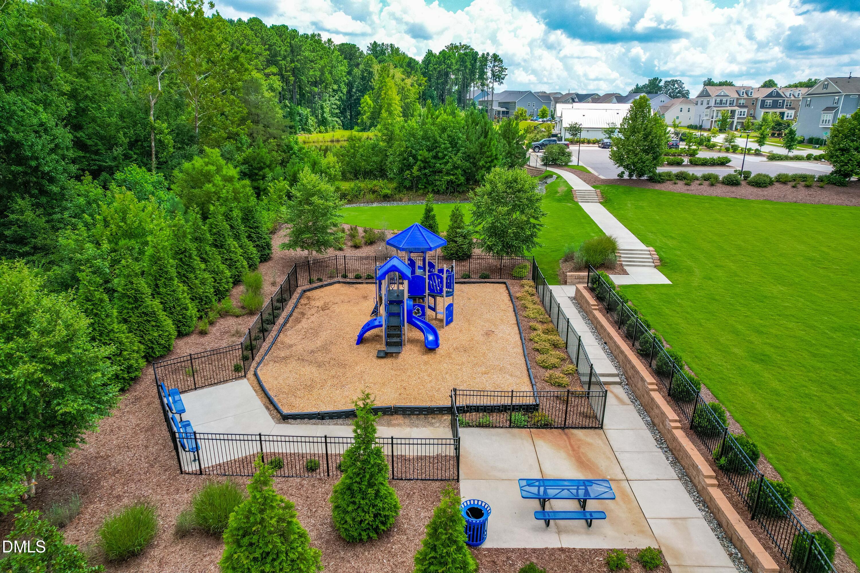 2906 Great Lawn Road Apex, NC 27502 - Photo 36 of 41 an aerial view of a house with a garden and swimming pool