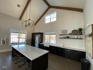 2906 Great Lawn Road Apex, NC 27502 - Photo 41 of 41 a kitchen with kitchen island a sink appliances and a counter top space