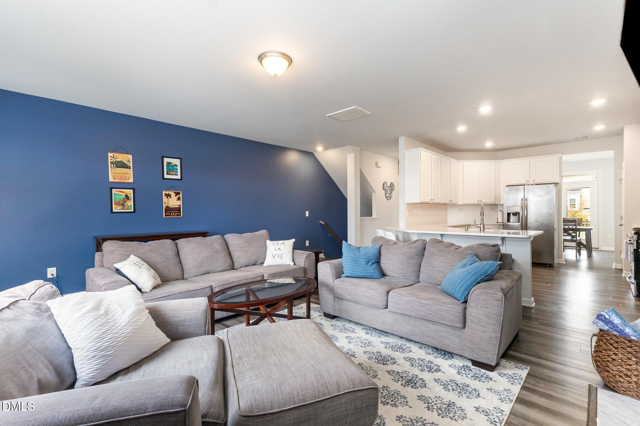 2906 Great Lawn Road Apex, NC 27502 - Photo 6 of 41 a living room with furniture and view of kitchen