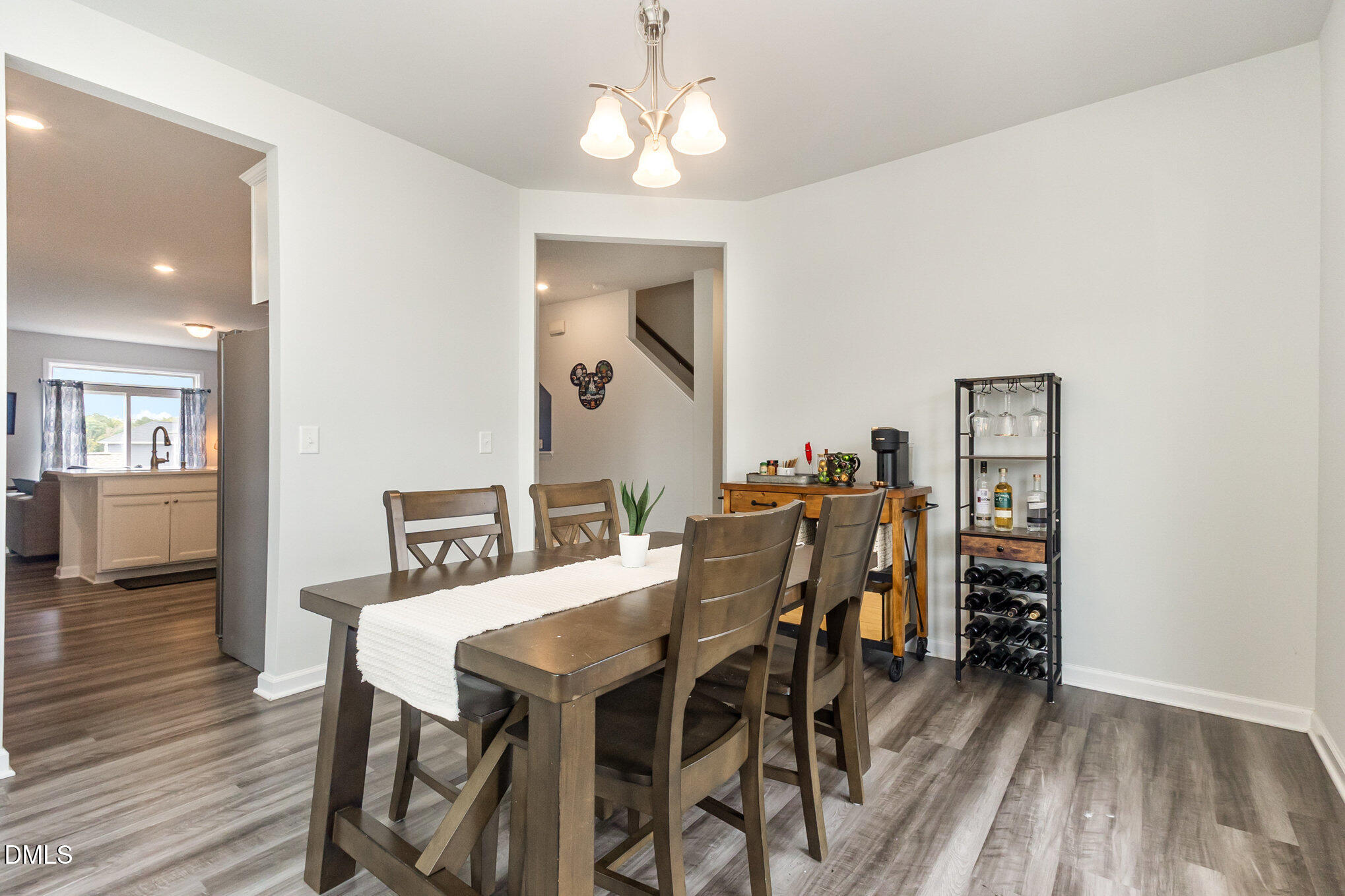 2906 Great Lawn Road Apex, NC 27502 - Photo 9 of 41 a view of a dining room with furniture and wooden floor