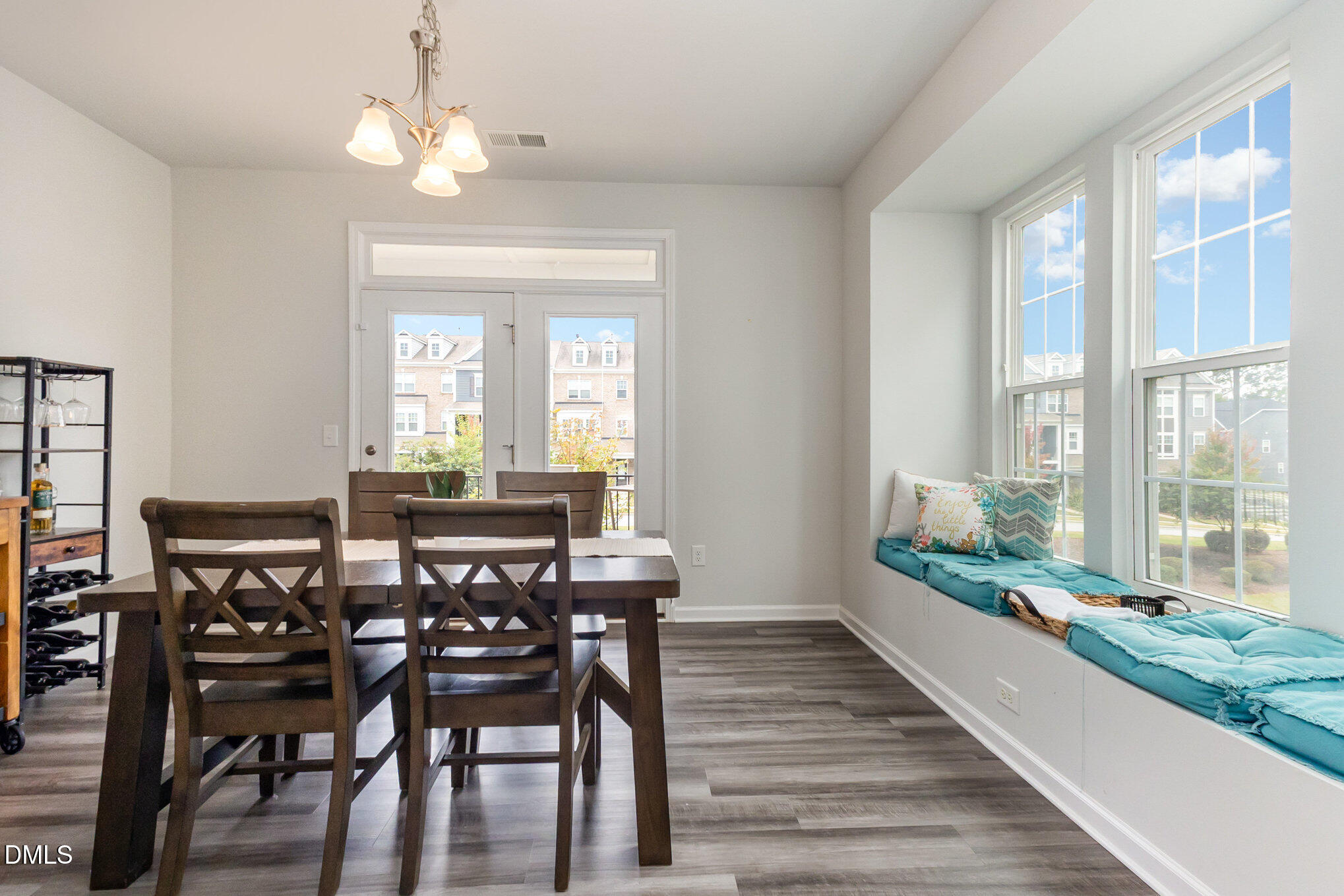 2906 Great Lawn Road Apex, NC 27502 - Photo 10 of 41 a view of a dining room with furniture window and wooden floor