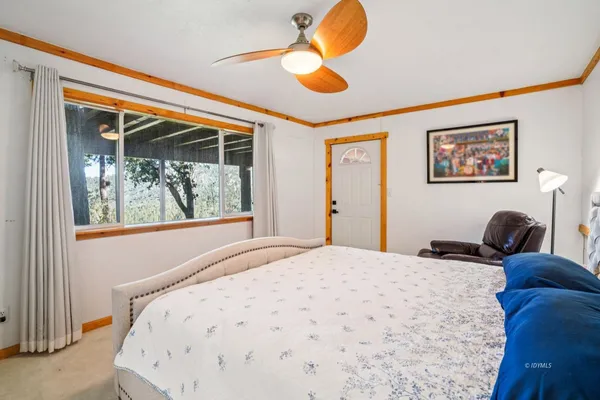 a bedroom with a bed and window