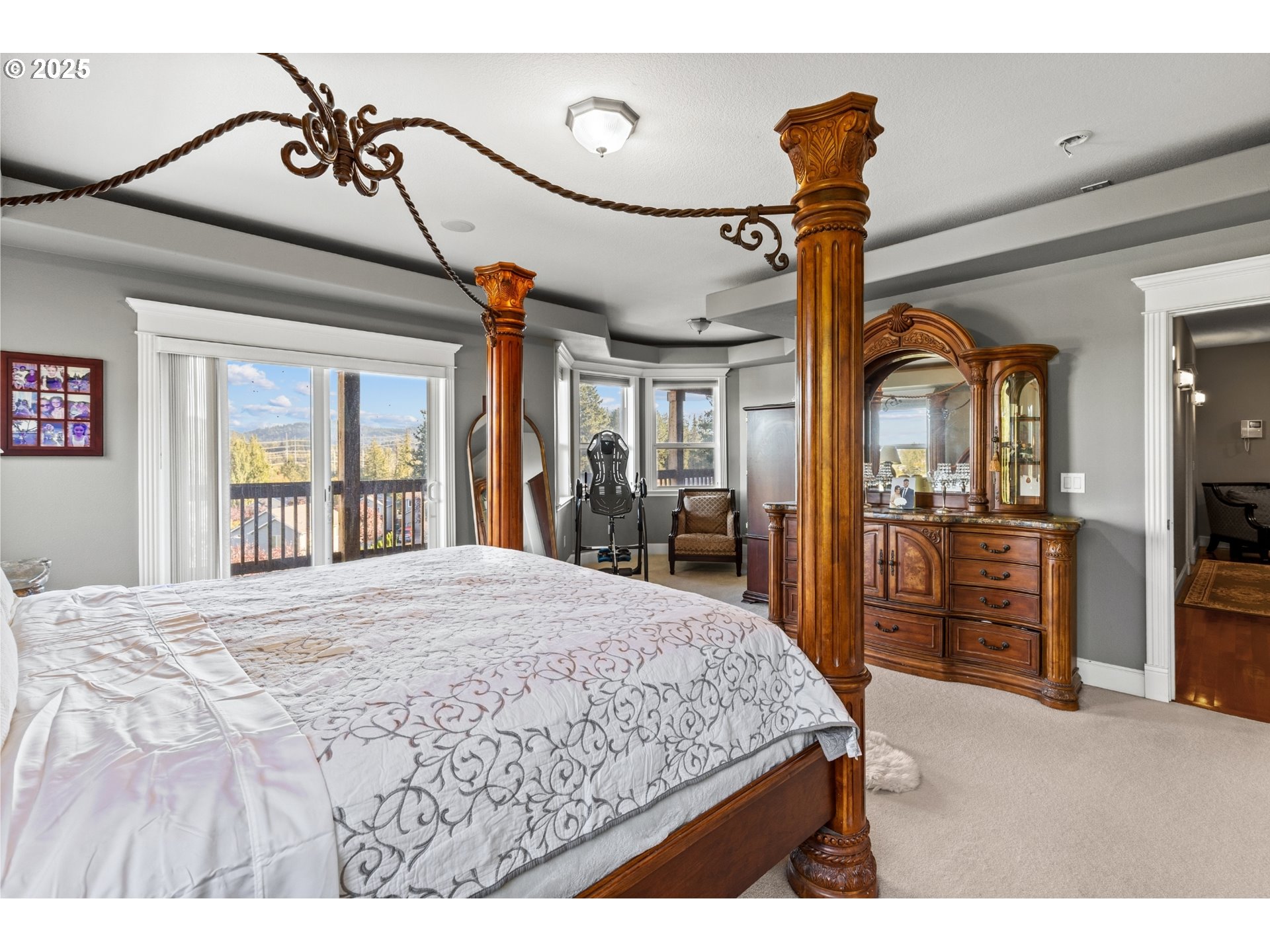 3412 Northwest 1st Street Gresham, OR 97030 - Photo 22 of 40 a bedroom with a bed and large mirror with a flat tv screen