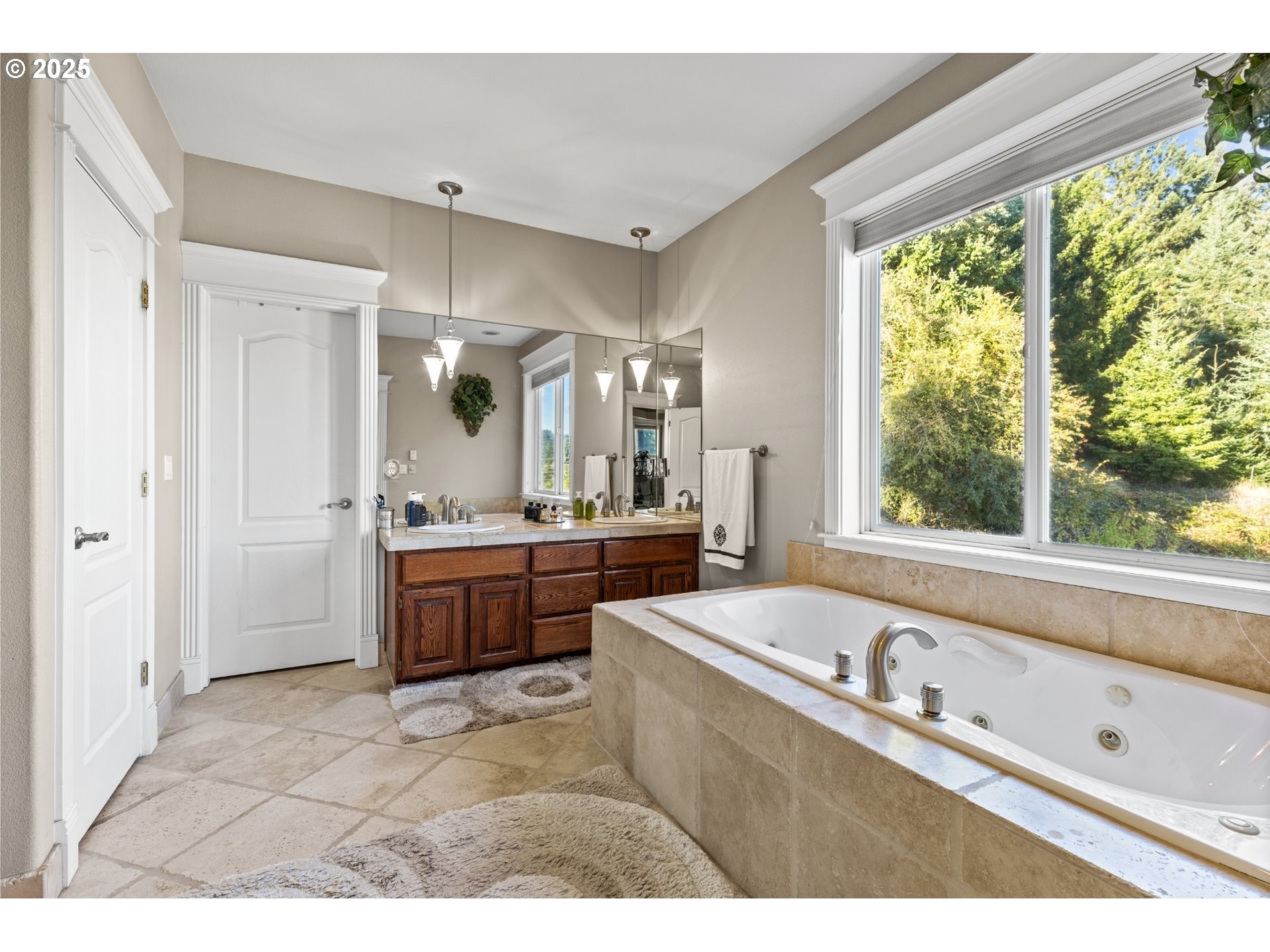 3412 Northwest 1st Street Gresham, OR 97030 - Photo 23 of 40 a bathroom with a tub sink and mirror
