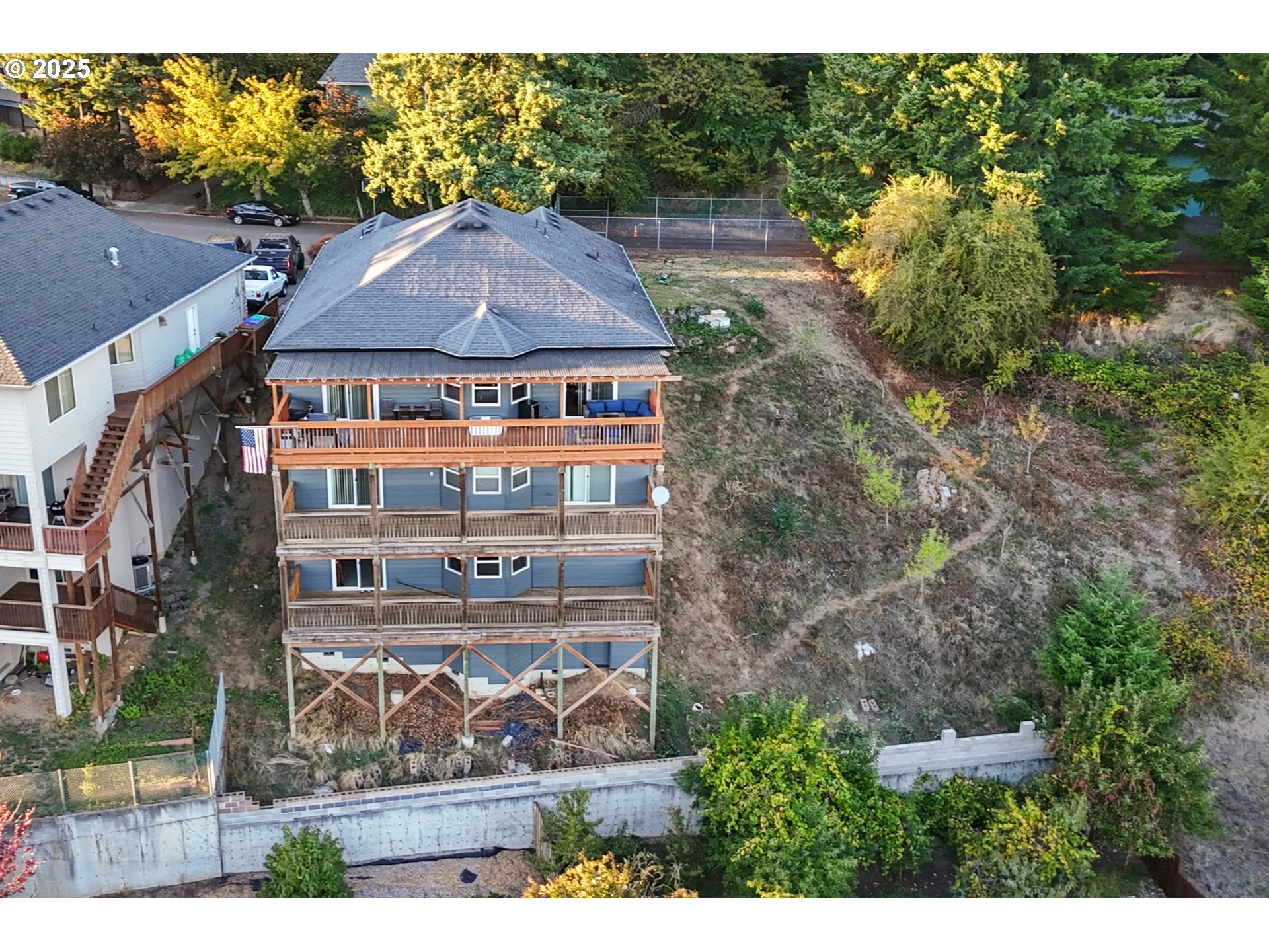 3412 Northwest 1st Street Gresham, OR 97030 - Photo 36 of 40 a view of a big house with a big yard and large trees