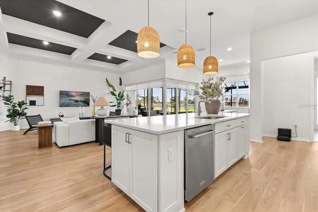 a bathroom with a granite countertop sink a mirror and a shower