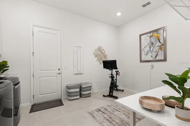 a bathroom with a double vanity sink a mirror and a shower