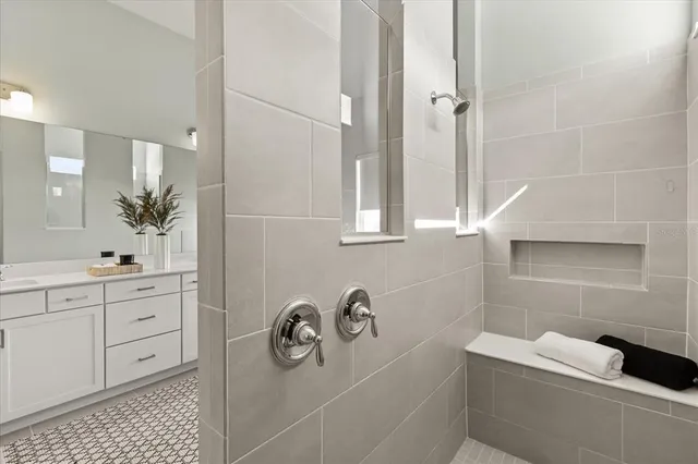 a living room with fireplace furniture and a large window