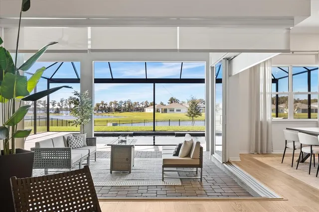 an aerial view of residential houses with outdoor space and swimming pool