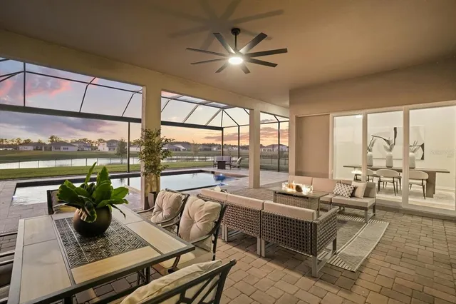 an aerial view of a house with a lake view