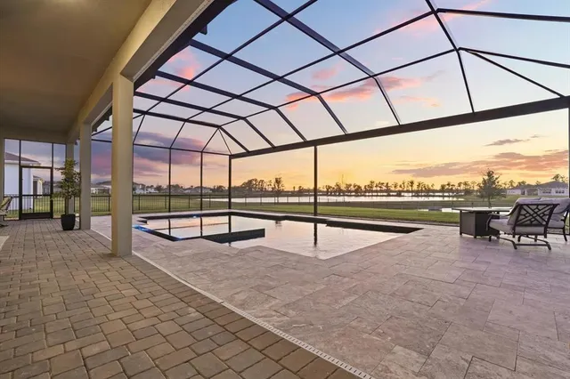 a view of a swimming pool with a patio