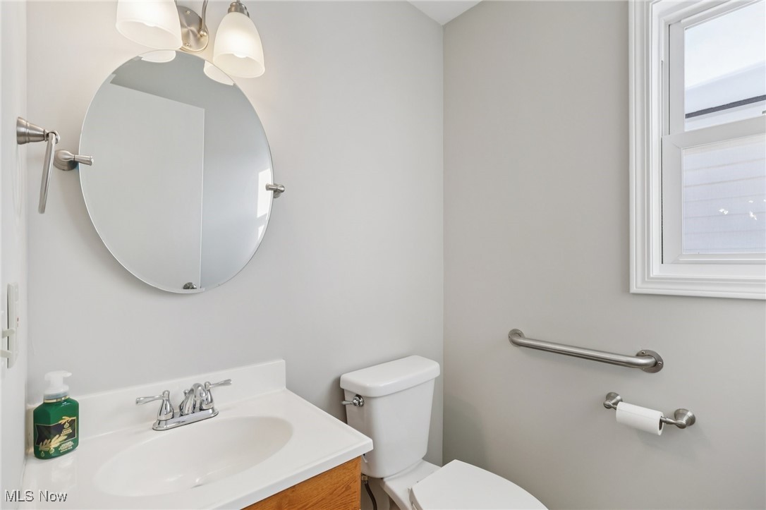611 Wilson Street Struthers, OH 44471 - Photo 21 of 44 Half bathroom with vanity and toilet