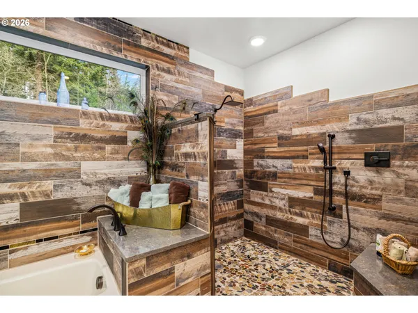 a view of living room with furniture and a floor to ceiling window