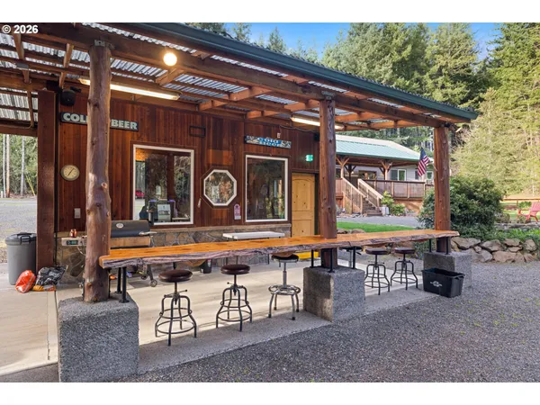 a wooden bench sitting in front of building