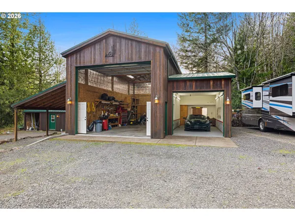 a view of a car park front of a house