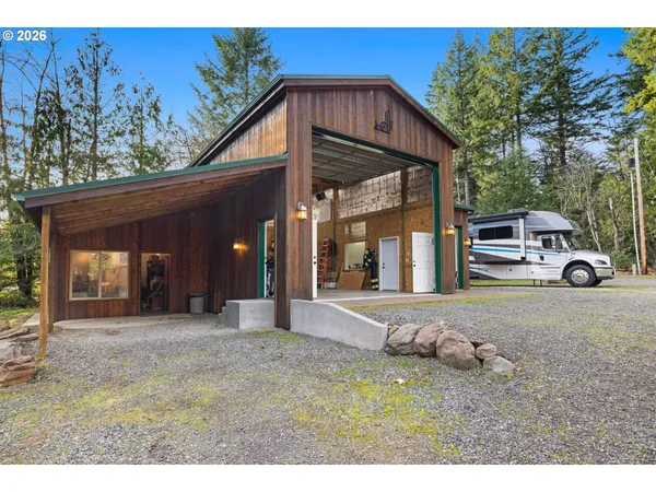 a view of a house with a yard and garage