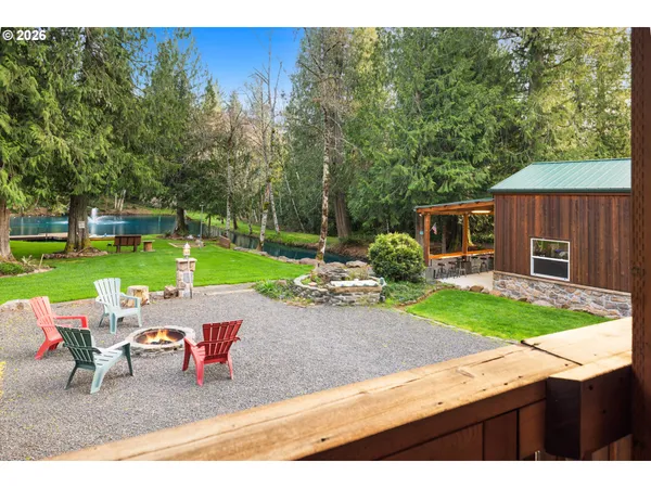 a view of a backyard with sitting area furniture and garden