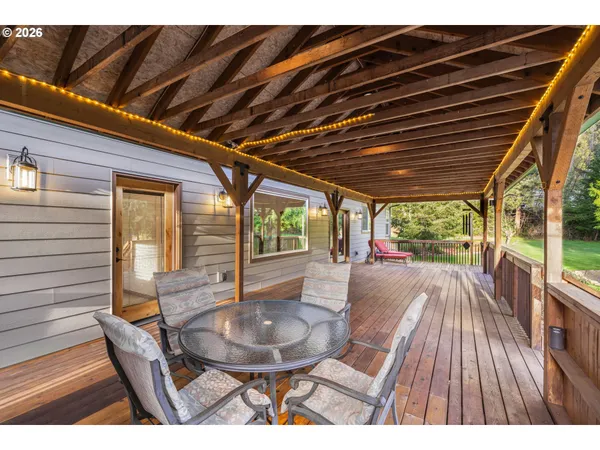 a view of a patio with a table chairs and a patio