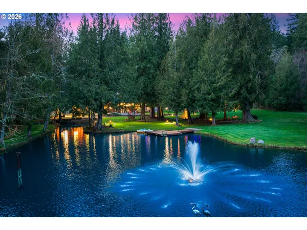 a view of a lake with a yard