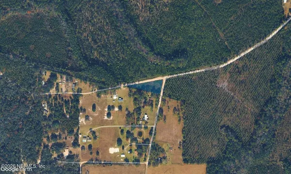 a view of balcony with wooden floor and fence