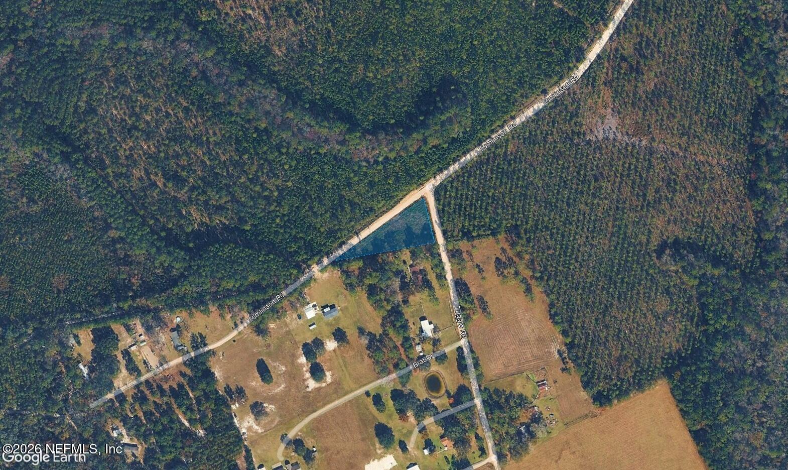 24454 Tuggle Road Hilliard, FL 32046 - Photo 6 of 11 a view of balcony with wooden floor and fence