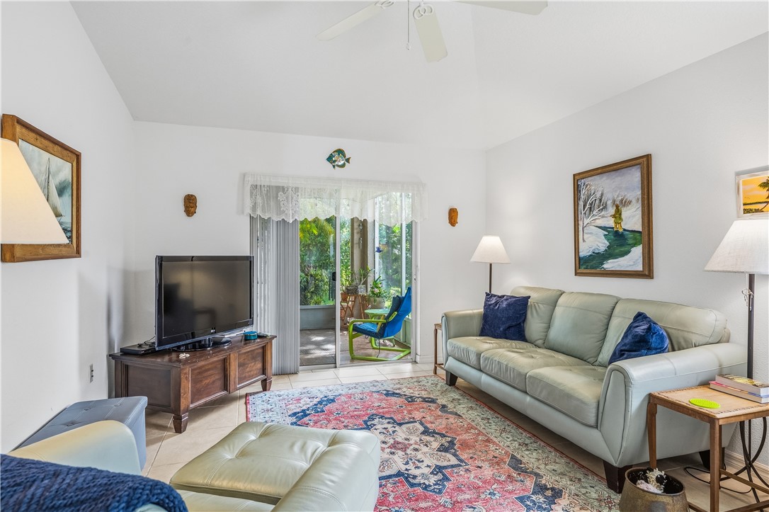 131 Bellamy Trail Sebastian, FL 32958 - Photo 7 of 32 a living room with furniture and a flat screen tv