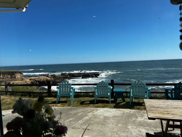 a view of a glass room with furniture