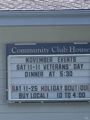 a street sign on a brick wall