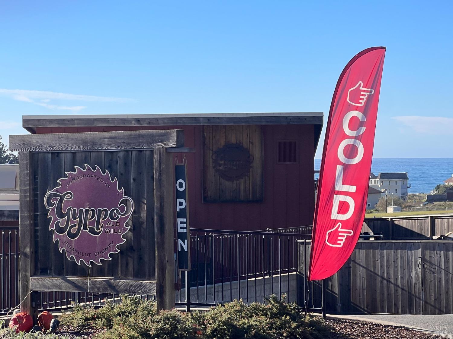 566 Redwood Road Whitethorn, CA 95589 - Photo 7 of 11 a street sign on a brick wall